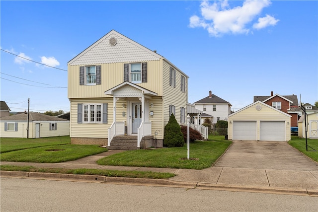 front of property featuring a front yard, a garage, and an outbuilding