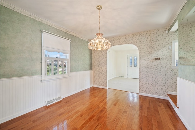 unfurnished dining area with hardwood / wood-style floors