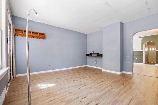 21 Ambridge Ave, Leet Twp, PA 15003 - spare room with arched walkways, wood finished floors, and baseboards
