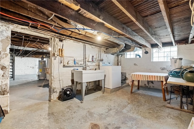 basement featuring washer and dryer and gas water heater