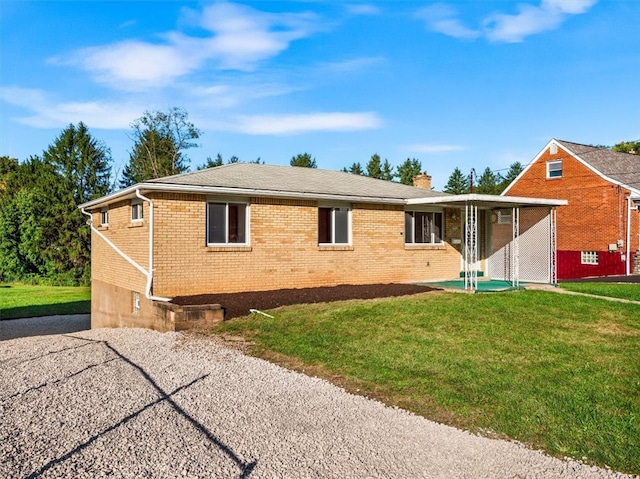 back of house featuring a yard and a patio area