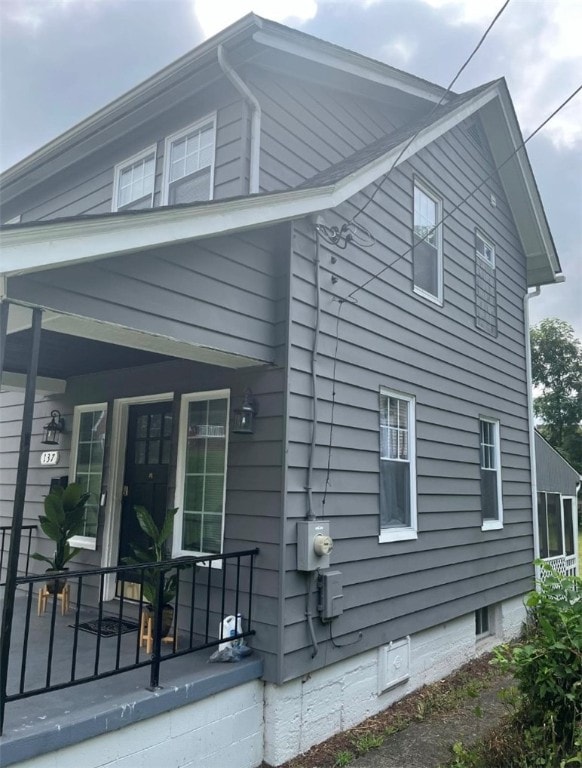 view of side of property with a porch