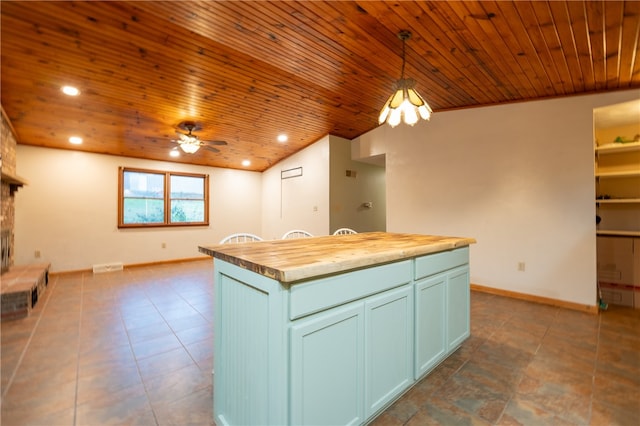 kitchen with wooden counters, wooden ceiling, a center island, pendant lighting, and ceiling fan