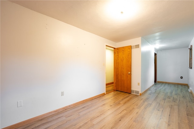 empty room featuring light hardwood / wood-style floors