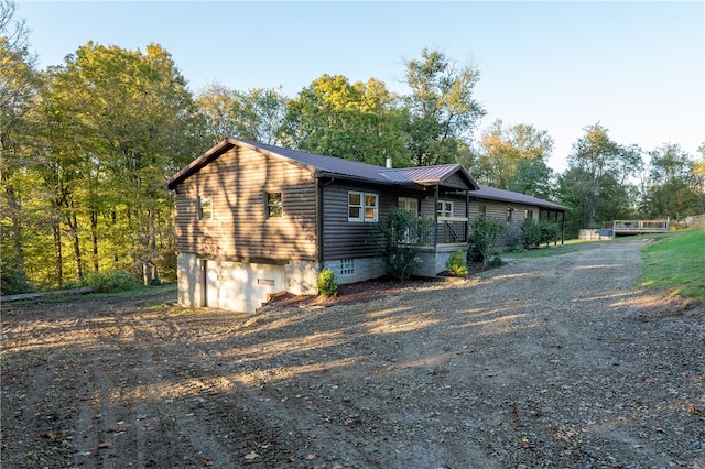 view of side of home featuring a garage