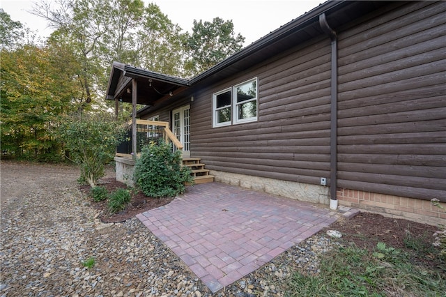 view of side of home featuring a patio