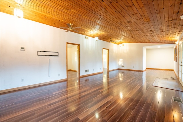 empty room with ceiling fan, wooden ceiling, and dark hardwood / wood-style floors