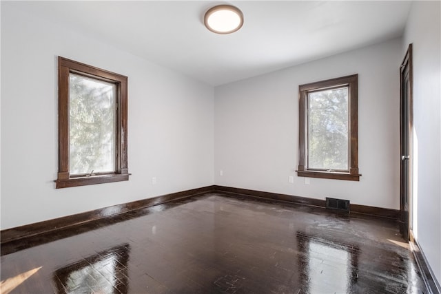 unfurnished room featuring hardwood / wood-style flooring