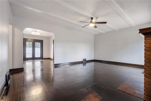 unfurnished room featuring french doors, beam ceiling, dark wood-type flooring, and ceiling fan