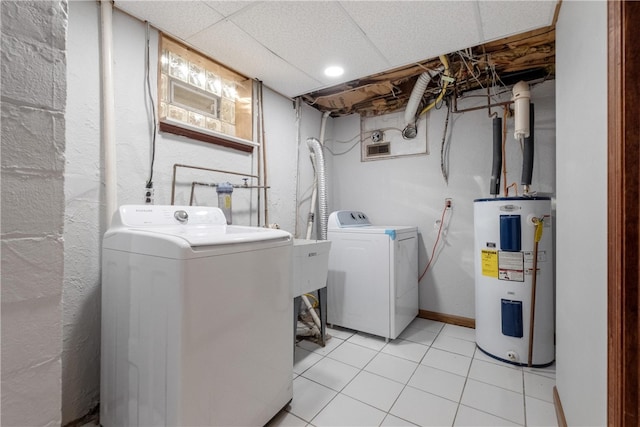 washroom with light tile patterned floors, separate washer and dryer, and water heater