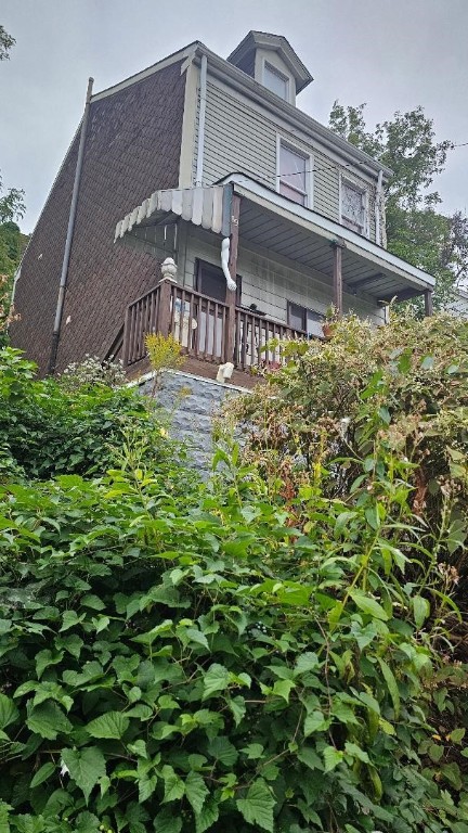 view of property exterior with a balcony