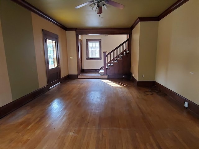 entrance foyer with ceiling fan, hardwood / wood-style flooring, and crown molding