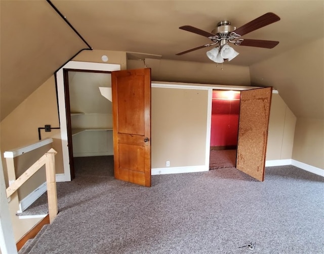 additional living space with vaulted ceiling, ceiling fan, and carpet flooring