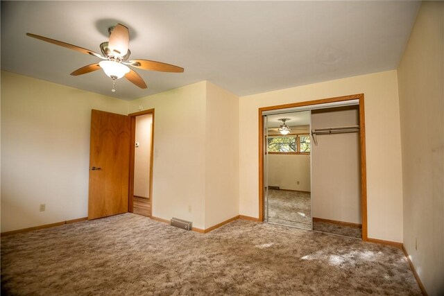 unfurnished bedroom with a closet, ceiling fan, and carpet flooring