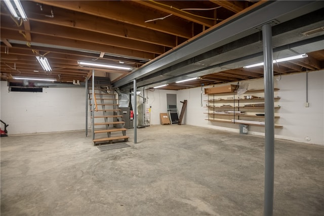 basement featuring gas water heater and heating unit