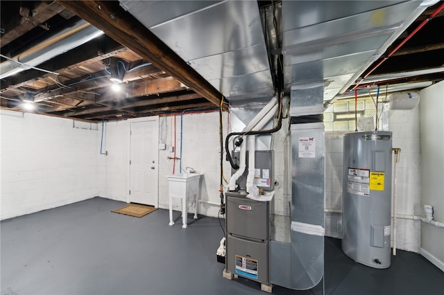 basement with heating unit and electric water heater