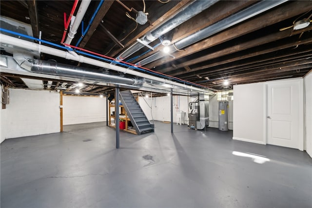 basement featuring water heater and heating unit