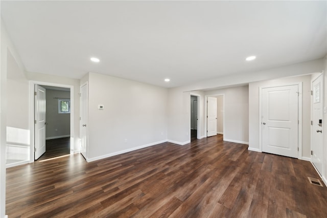 spare room featuring dark hardwood / wood-style floors