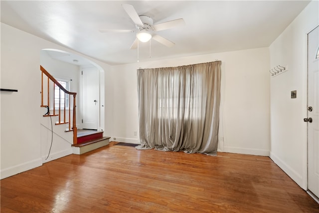 interior space with ceiling fan and hardwood / wood-style flooring