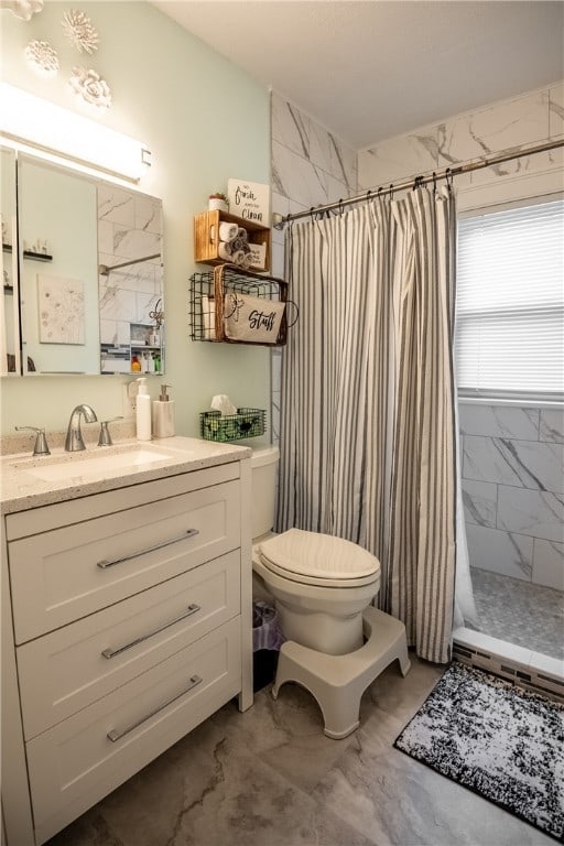 bathroom with vanity, toilet, and a shower with curtain