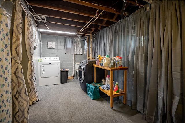 basement featuring separate washer and dryer and carpet flooring