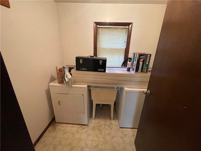 washroom with washing machine and clothes dryer