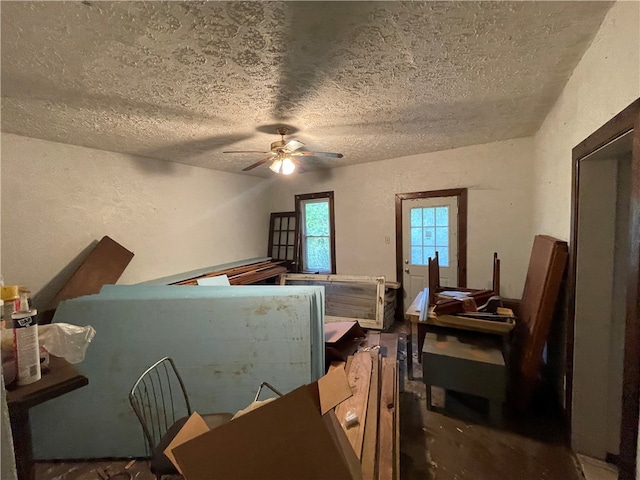 bedroom featuring a textured ceiling and ceiling fan