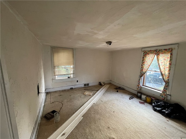 unfurnished room with carpet flooring