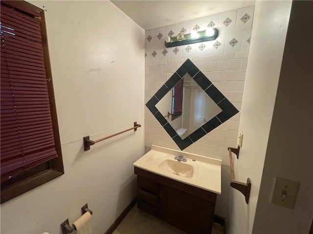 bathroom featuring decorative backsplash and vanity