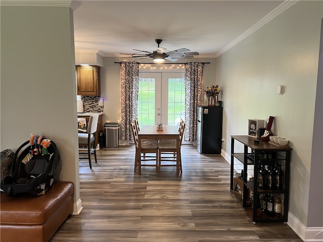 dining room with french doors, ceiling fan, ornamental molding, and dark hardwood / wood-style flooring