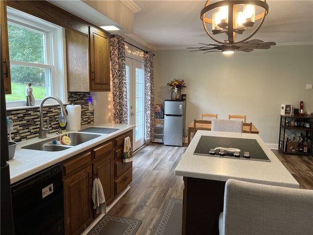 384 Grove Rd, Jefferson Twp Mer, PA 16137 - kitchen featuring a sink, crown molding, black appliances, and a notable chandelier