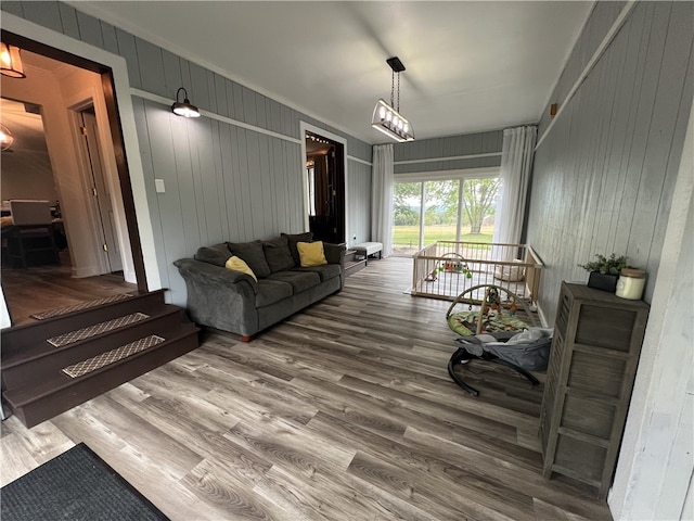 living room featuring wood walls and hardwood / wood-style floors