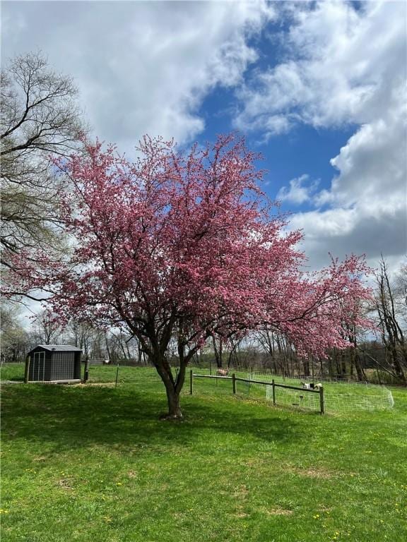 384 Grove Rd, Jefferson Twp Mer, PA 16137 - exterior space featuring fence, an outbuilding, and a shed