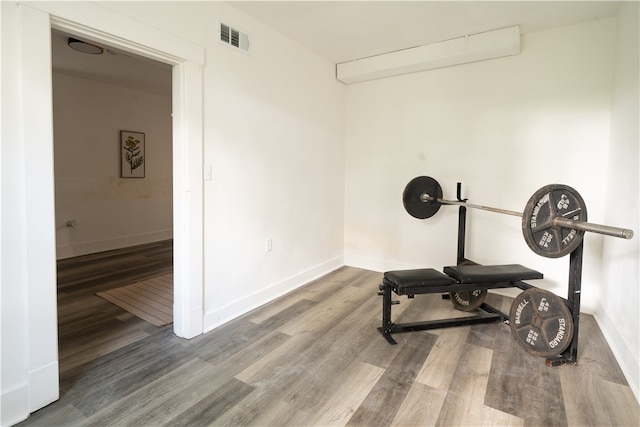 workout room with hardwood / wood-style flooring