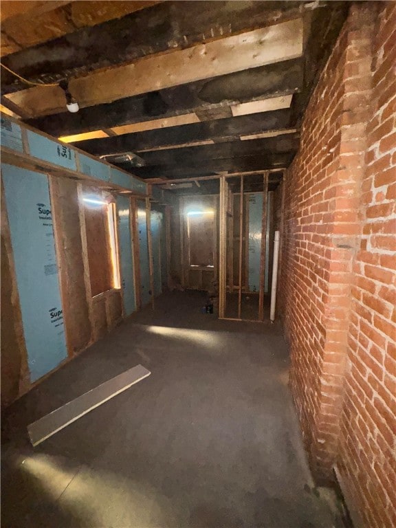 basement with brick wall