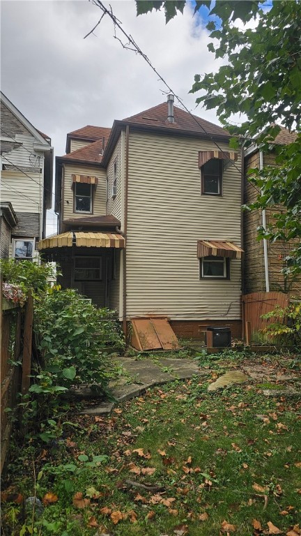 view of side of property with central AC unit