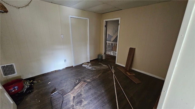 unfurnished room featuring dark hardwood / wood-style floors