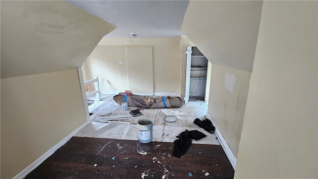 bonus room featuring wood-type flooring and lofted ceiling