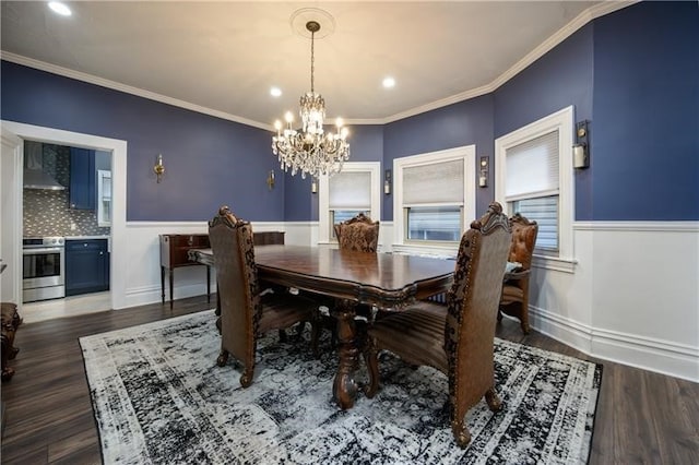 dining area with ornamental molding, dark wood-type flooring, and a chandelier