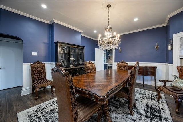 dining room with dark wood-type flooring and crown molding