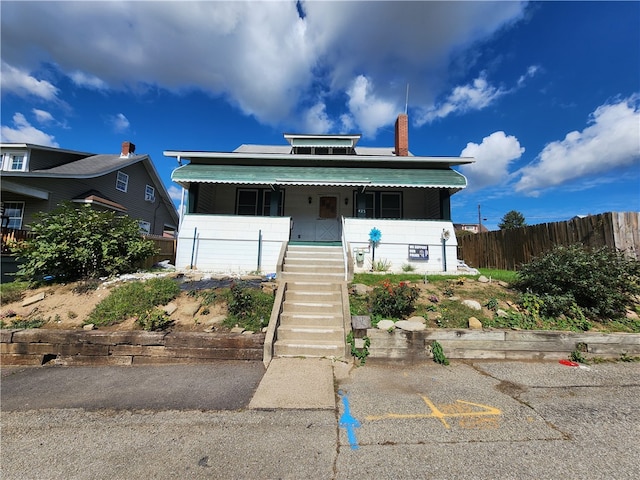 view of front of home featuring covered porch