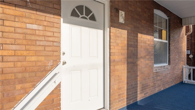 doorway to property with a porch