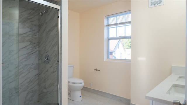 bathroom with vanity, toilet, and an enclosed shower