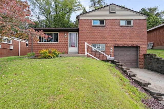 split level home featuring a garage and a front lawn