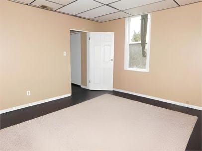 spare room with a paneled ceiling