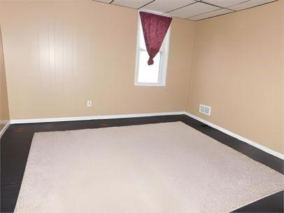 spare room with a drop ceiling