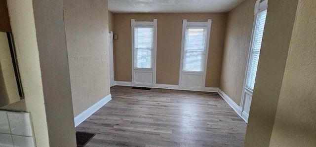 spare room with light hardwood / wood-style floors