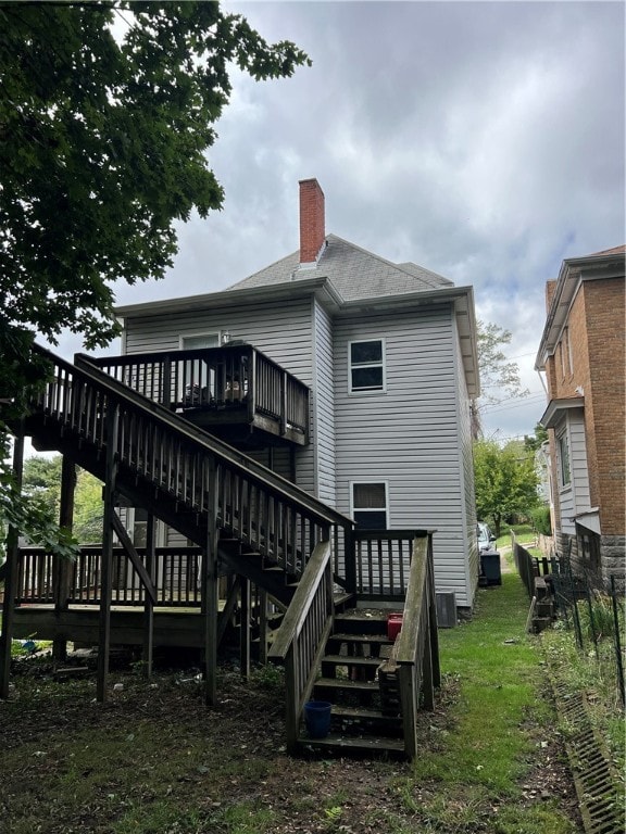 rear view of property with a deck