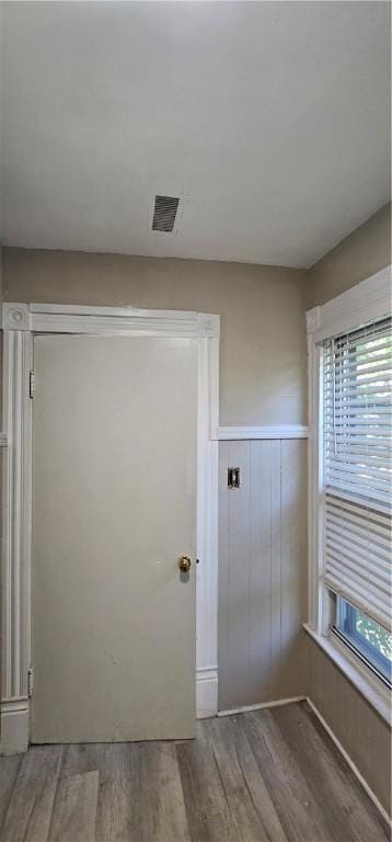 doorway with hardwood / wood-style flooring