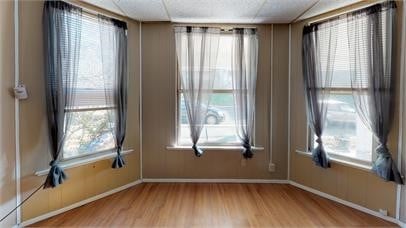 unfurnished room with light hardwood / wood-style flooring